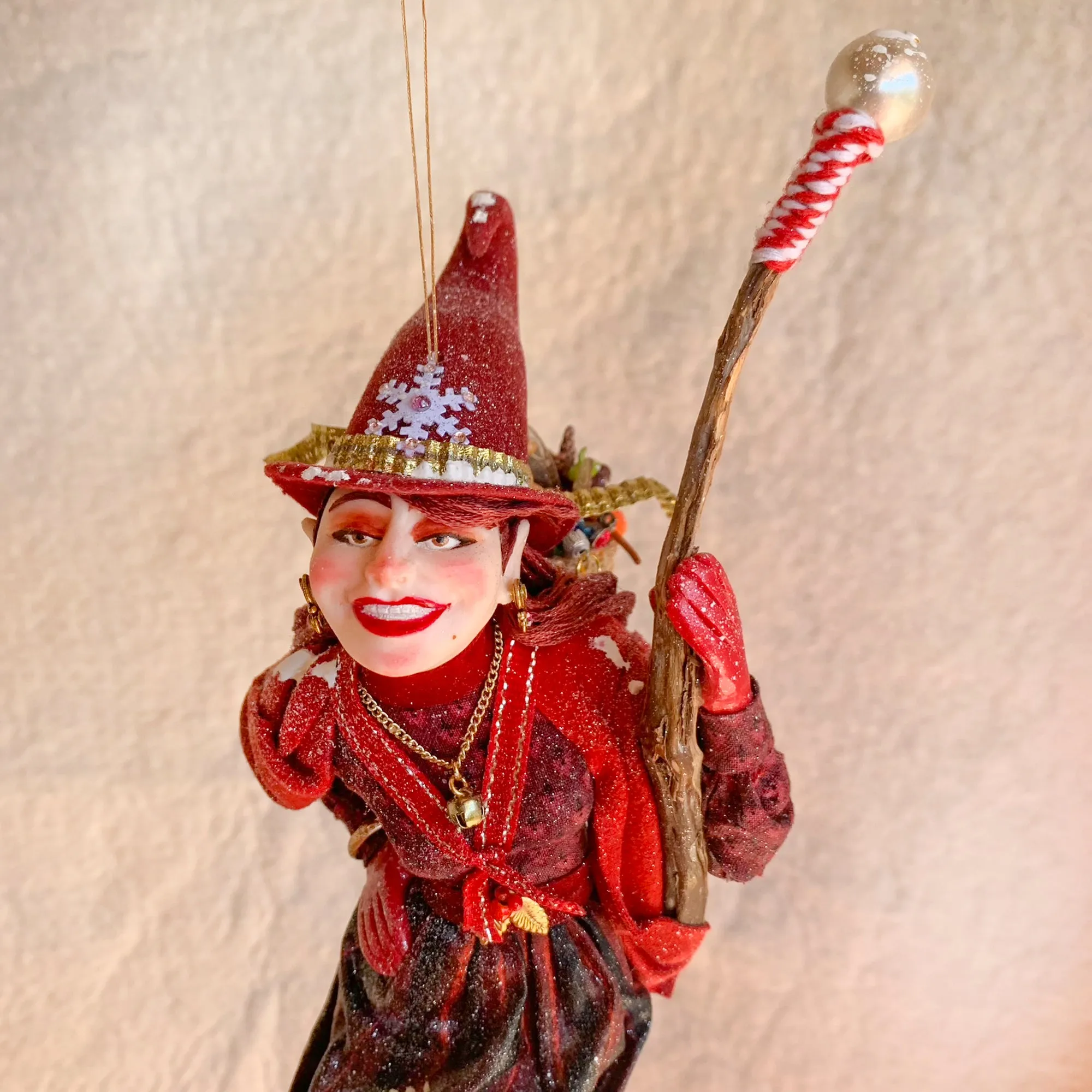 La Bafana - Hovering on her broom Christmas eve waiting to deliver a basket full of Christmas gifts - Hanging Ornament