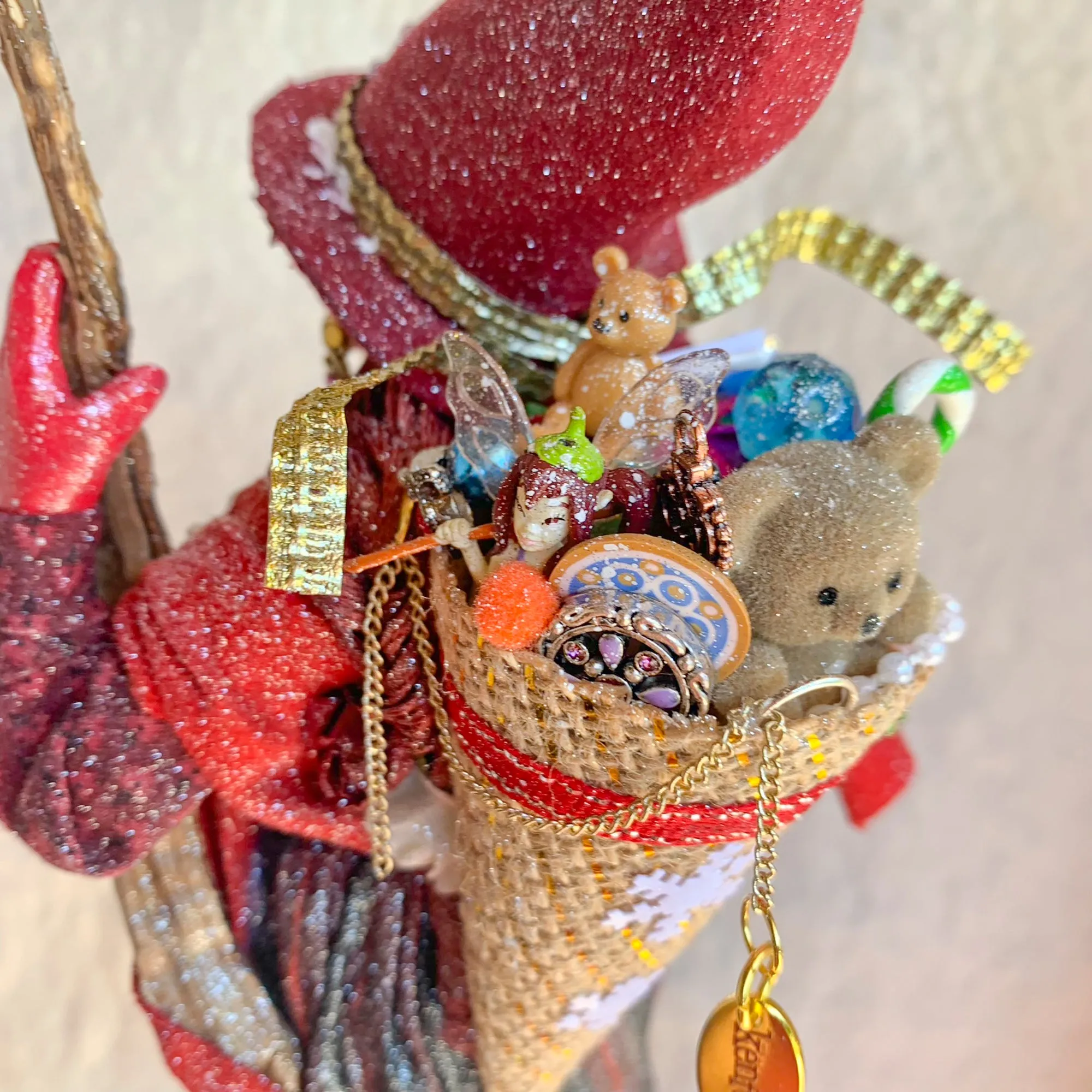 La Bafana - Hovering on her broom Christmas eve waiting to deliver a basket full of Christmas gifts - Hanging Ornament